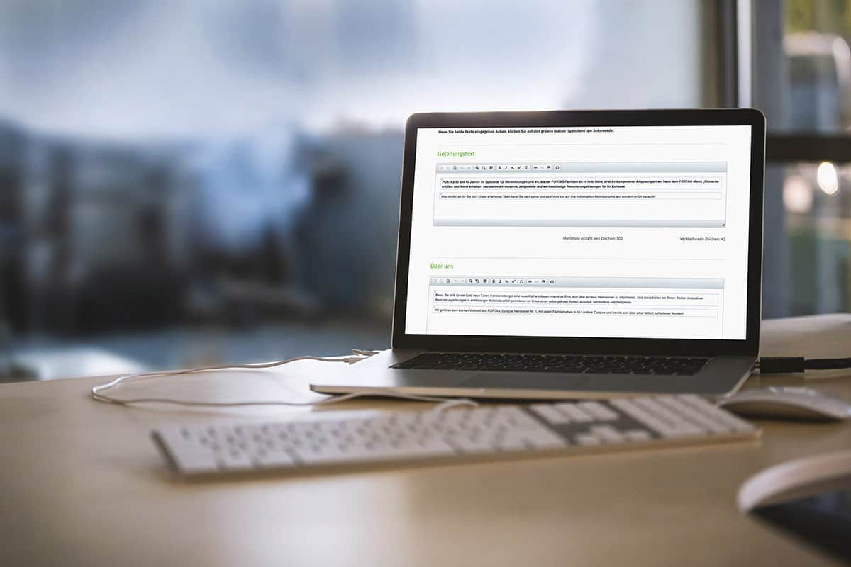 Laptop in an office showing the content management system’s input form with fields for the introduction and “About us”