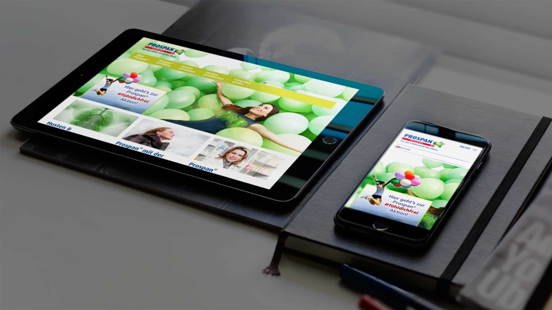 Tablet and smartphone on a notebook, both showing the Prospan home page