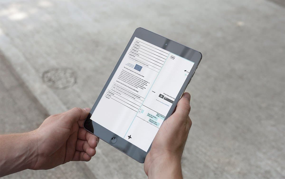 Tablet showing the open menu of the website and the logo of the Culture Programme of the European Union