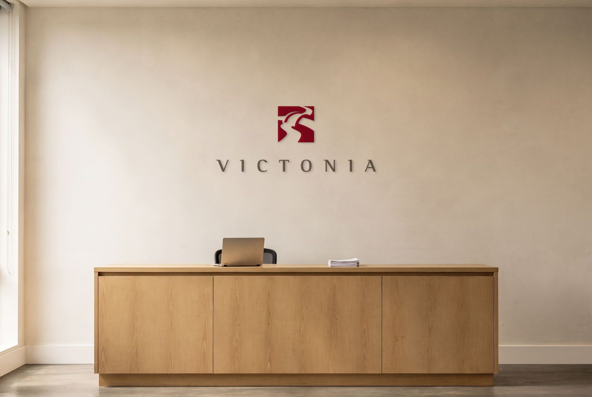 The Victonia logo on the wall above the reception desk