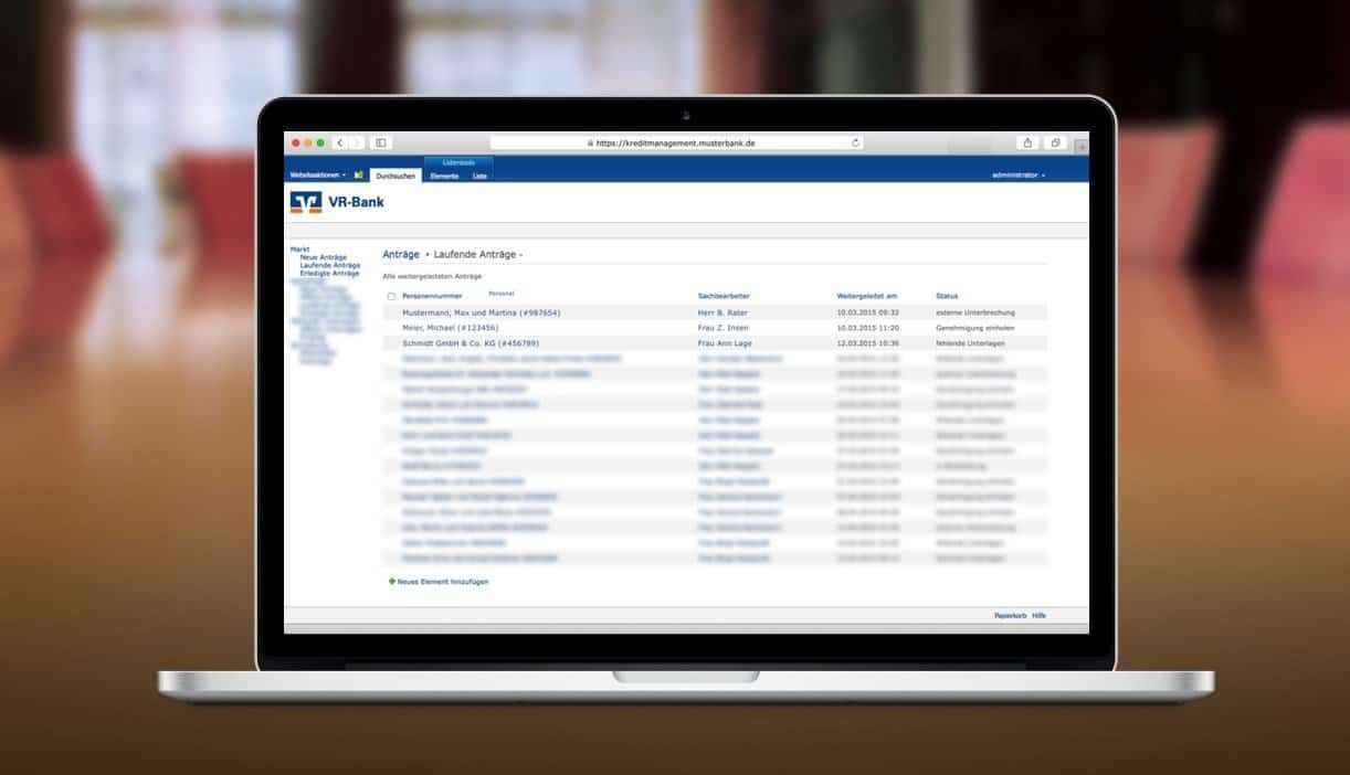Laptop showing the current applications overview: a branch's loan applications with case handler and status